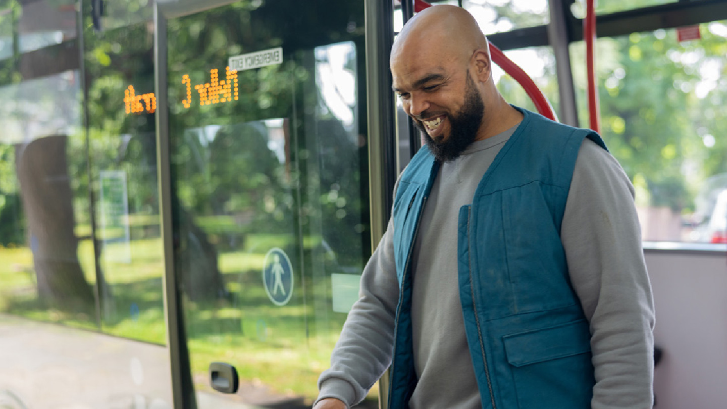 Person smiling on bus